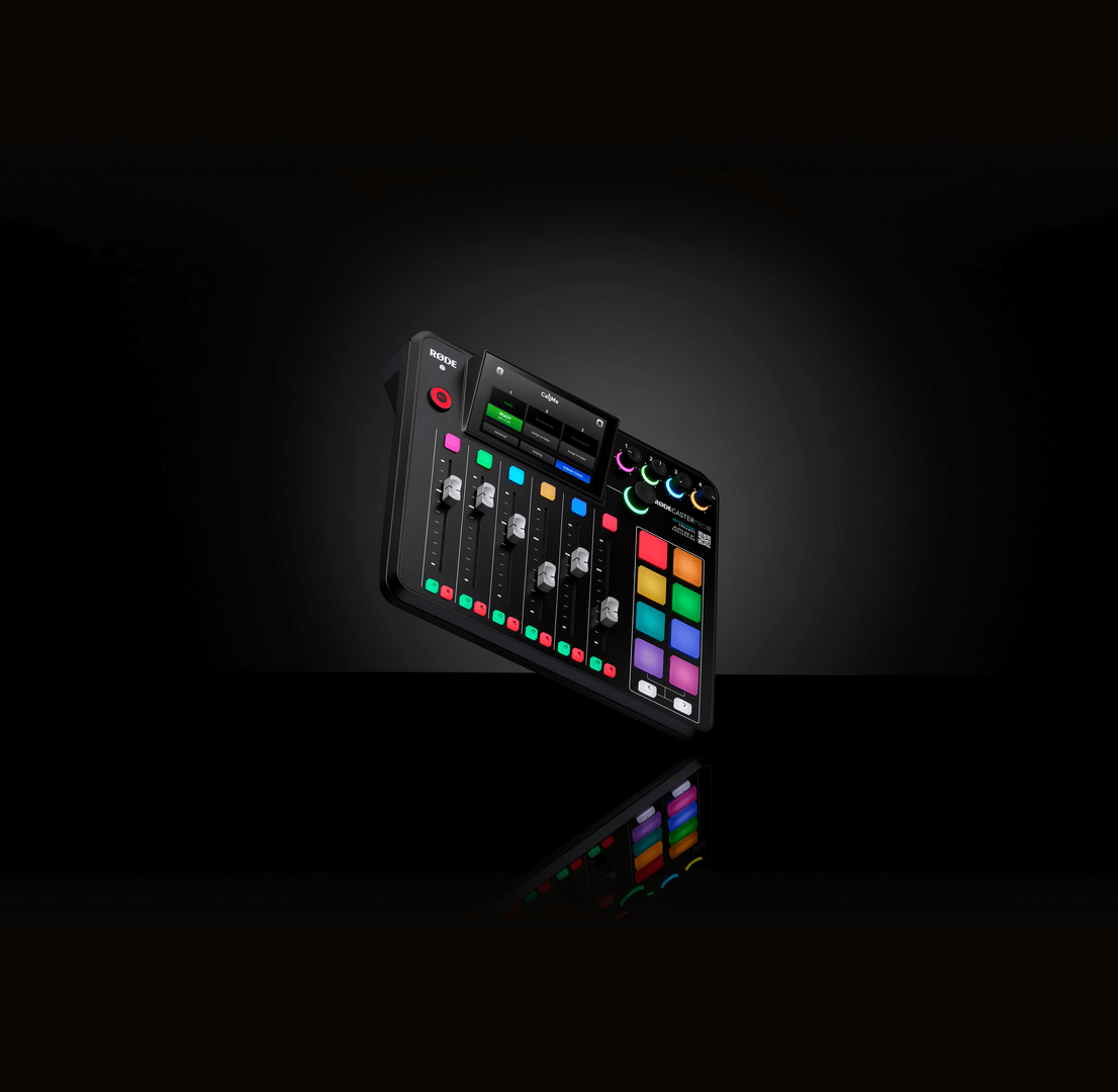 RØDECaster Pro II product shot on black, standing on its edge with the faders and SMART pads lit.